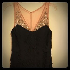 Formal dark navy evening gown with beading in front.